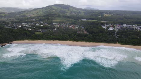 Idyllic-Beach-With-Foamy-Ocean-Waves-Washing-On-Shore-In-Sapphire-Beach,-Coffs-Harbour,-NSW,-Australia---aerial-drone-shot