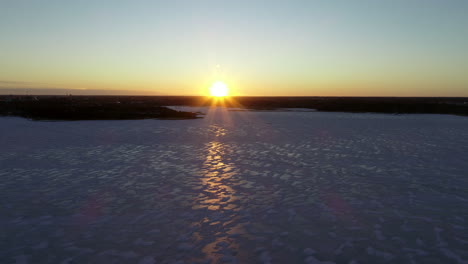 Aerial-sunset-of-winter-ice-landscape