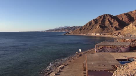 View-of-Dahab-Blue-Hole-on-Red-Sea-from-nearby-rocky-desert-hilltop