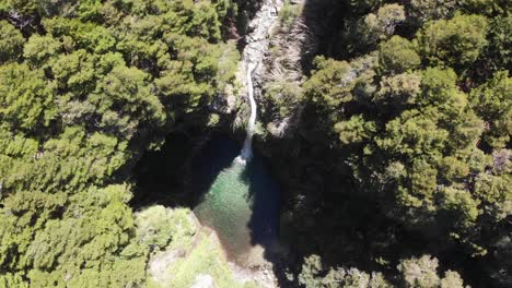 Descending-vertical-aerial-of-clear,-cold-Rio-Bonito-Falls,-Argentina