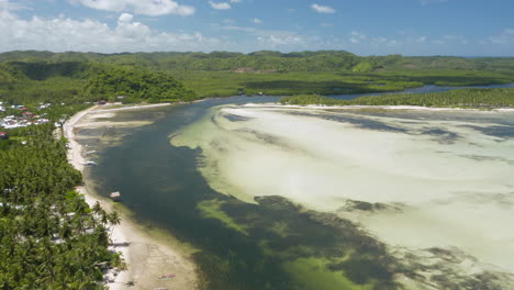 Aerial-showing-bay-between-Union-Beach-and-Doot-Beach-nearby-General-Luna,-Siargao-Island,-Philippines