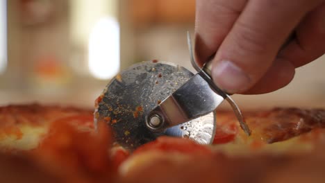 Slicing-Pizza-with-Rolling-Cutter,-Close-up-Slow-Motion-with-Copy-Space
