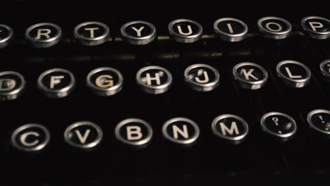Slow-diagonal-tracking-shot-along-keys-of-vintage-manual-German-typewriter