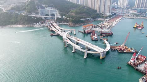 Hong-Kong-cross-bay-link-construction-project,-a-dual-two-lane-bridge-connecting-Tseung-Kwan-O-Lam-Tin-Tunnel-to-Wan-Po-Road,-Aerial-view