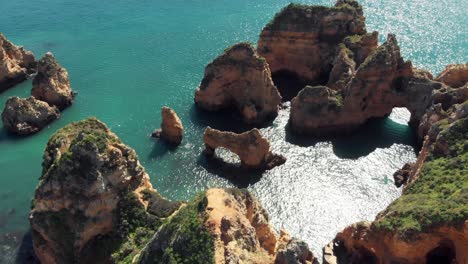 Epic-rock-formations-of-Ponta-da-Piedade,-southernmost-point-in-Lagos,-Algarve,-Portugal