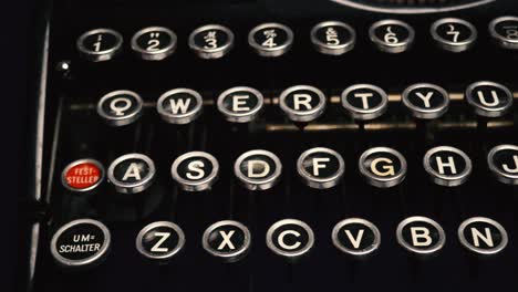 Close-up-tracking-shot-along-keys-of-old,-vintage-manual-German-typewriter