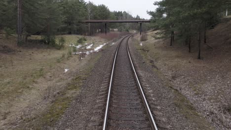 AERIAL:-Slow-Flight-Over-Railway-Tracks-Towards-Overpass-Bridge