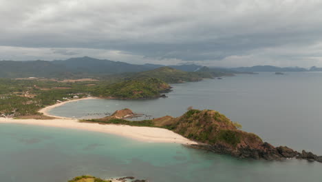 Aerial-showing-Twin-Beach-and-Nacpan-Beach-together-nearby-El-Nido,-Palawan,-Philippines