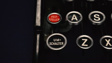 Top-down-close-up-tracking-shot-over-round-keys-of-vintage-German-typewriter