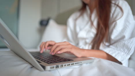 Hand-of-unrecognizable-woman-typing-on-laptop-keyboard