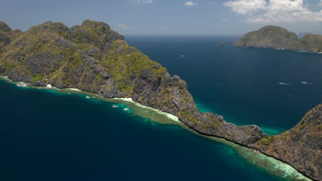 Aerial-showing-Matinloc-Island-from-above-nearby-El-Nido,-Palawan,-Philippines
