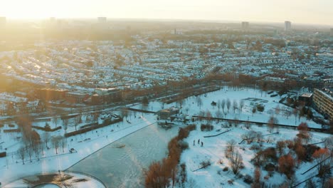 Aerial---Snowy-winter-over-Griftpark-in-Utrecht,-Netherlands,-wide-shot