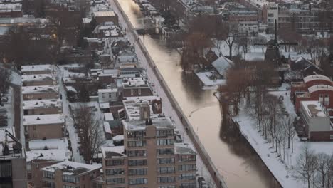 Snow-Falling-Over-Utrecht-City,-Netherlands,-White-Covered-Roofs,-High-Angle-View