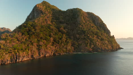 Aerial-Golden-Hour-of-mountain-El-Nido-with-sunset,-Palawan,-Philippines
