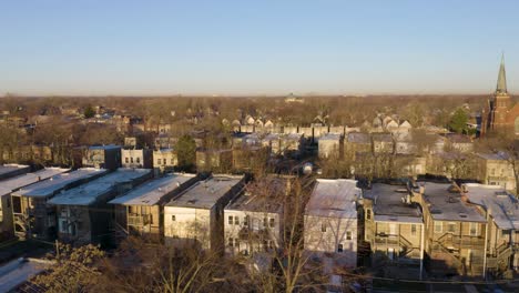 Low-Angle-Aerial-Shot-of-Urban-Houses-in-Low-Income-Neighborhood