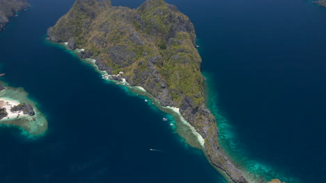 Matinloc-Island-from-high-above-with-multiply-Snorkeling-tours-nearby-El-Nido,-Palawan,-Philippines