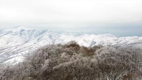 Mountains-covered-in-snow-in-winter-drone-shot