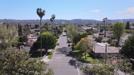 Rising-aerial,-daytime-view-of-residential-neighborhood-of-houses,-Van-Nuys,-California