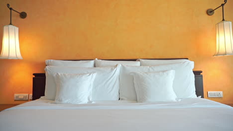 Tilt-down-on-a-hotel-suite-bed-complete-with-three-different-sizes-of-pillows
