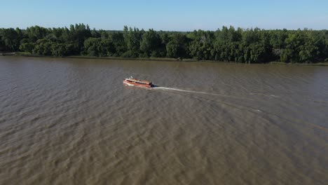 Aerial-view-of-Tourist-boat-sailing-through-amazon-river-during-sunny-day