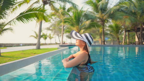 Asian-model-cooling-down-at-a-exotic-pool-at-Pattaya