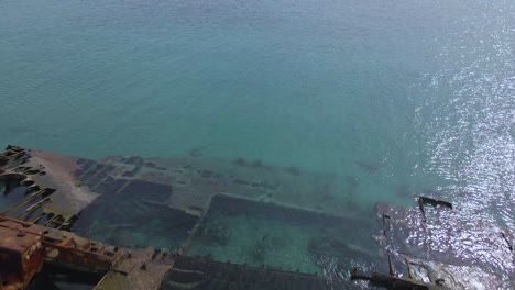 4K-clip-flying-over-a-shipwreck-in-the-tropical-beach-of-Epanomi,-Norhtern-Greece