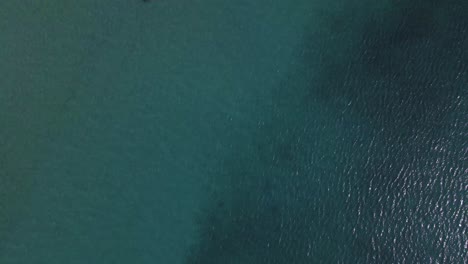 4K-overhead-moving-forward-clip-over-a-shipwreck-in-the-tropical-beach-of-Epanomi,-Norhtern-Greece
