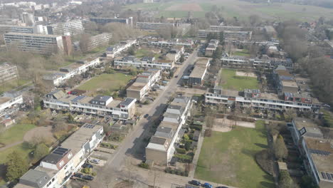 Aerial-of-peaceful-suburban-neighborhood-with-small-green-parks