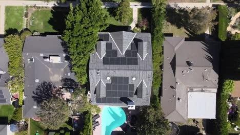 Top-down-aerial-view,-solar-panels-on-house-roof,-Van-Nuys,-California