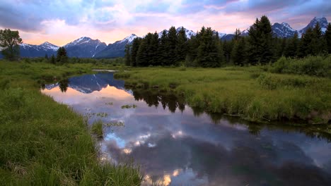Sky,-Mountain-Peak-And-Forest-Reflecting-On-River-At-Grand-Teton-National-Park