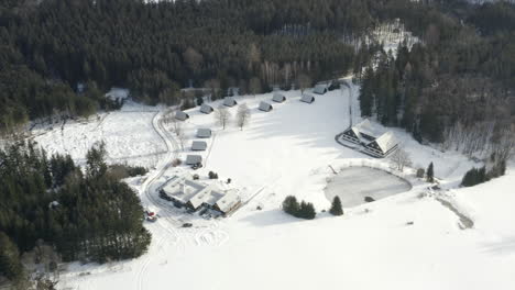 Aerial-Shot-Of-A-Winter-Ski-Camp-With-Mountain-Landscape-In-Zubri,-Czech-Republic