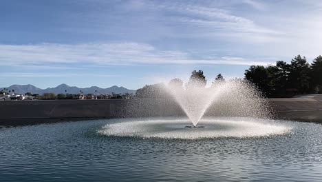 Slow-motion-of-the-water-flowing-from-one-of-the-many-fountains-in-McCormick-Ranch,-Scottsdale,-Arizona