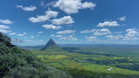 Glorious-blue-skies-with-white-coulds-in-a-wide-shot-looking-out-over-the-Glasshouse-Mountains-from-the-summit-of-Mount-Ngungun