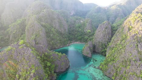 Aerial-view-of-limestone-karst-scenery-and-turquoise-ocean-water-in-Coron-Island,-Palawan,-Philippines
