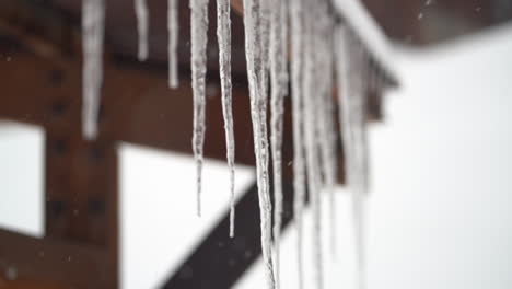 Ice-Dams-on-Sloped-Roof-on-Cold-Winter-Day,-Close-Up,-Selective-Focus