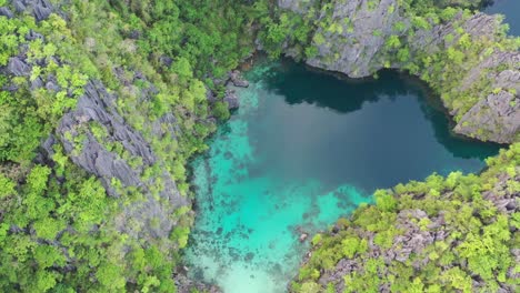 Aerial-of-limestone-karst-scenery-and-turquoise-ocean-water-in-Coron-Island,-Palawan,-Philippines
