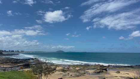 Beautiful-wide-shot-looking-up-the-Queensland-coast-from-Caloundra,-North-over-the-rocky-shoreline-towards-Mount-Coolum