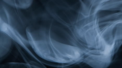 Slow-motion-of-abstract-white-smoke-against-black-background
