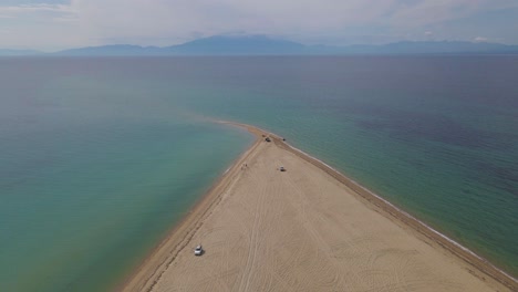 4k-forward-moving-clip-over-a-peninsula-on-the-tropical-beach-of-Epanomi,-Halkidiki,-Greece