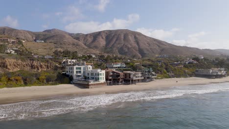 Seafront-residential-houses-over-El-Matador-beach-at-Malibu,-California