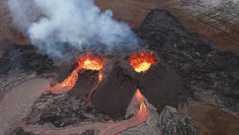 Volcano-Crater-Eruption-With-Flowing-Lava-And-Smoke---Fagradalsfjall-Volcano-Eruption-In-Reykjanes-Peninsula,-South-Iceland---aerial-orbit