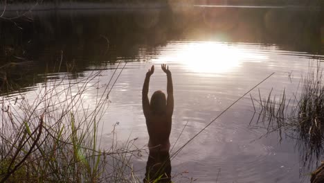 Back-View-Of-A-Half-Naked-Woman-Ready-To-Swim-On-A-Calm-Blue-Lake-At-Naree-Budjong-Djara-National-Park,-North-Stradbroke-Island,-Queensland-Australia