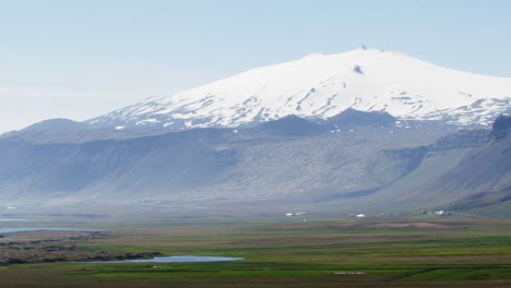Snow-covered-mountain-in-Snaefellsnes-Peninsula,-Iceland,-wide-shot-zoom-in