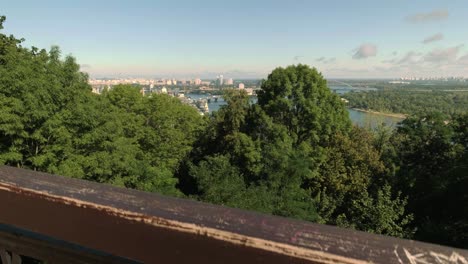 Camera-rises-to-reveal-Northern-Kiev-and-Dnieper-River-from-Volodymyrska-Hill-on-a-sunny-autumn-morning