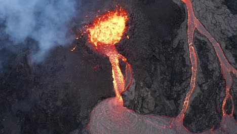Aerial-view-overlooking-a-volcanic-eruption,-in-Iceland---top-down,-drone-shot