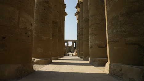 Ancient-Columns-In-Luxor-Temple,-Luxor,-Egypt---tilt-down-shot