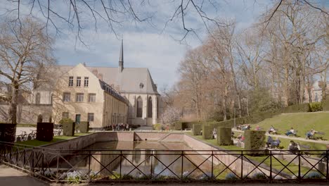 Wide-angle-shot-of-the-public-garden-of-La-Cambre-Abbey-on-a-sunny-day---Brussels,-Belgium