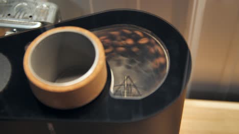 Coffee-beans-spinning-in-a-drum-roaster,-slow-motion-close-up