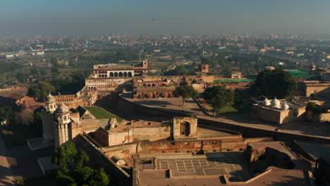 Aerial-View-Of-Citadel-Of-Lahore-Fort-At-Sunrise-In-Lahore,-Punjab,-Pakistan