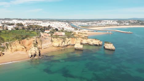 Lagos-Old-town-Coastline-that-stretches-along-side-Algarve-Atlantic-sea,-Portugal---Aerial-wide-panoramic-shot